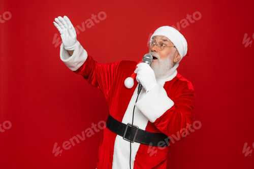 Preview: Photo crazy santa claus sing microphone song enjoy x-mas christmas jolly party isolated