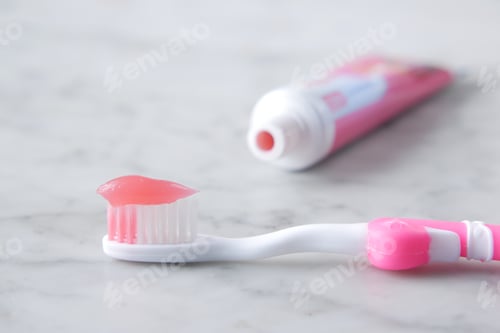 Preview: pink color child tooth brush with paste