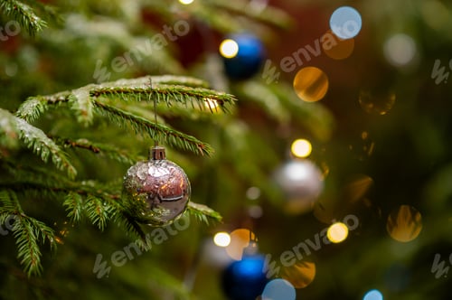 Preview: Christmas ornament hanging on green fir branch