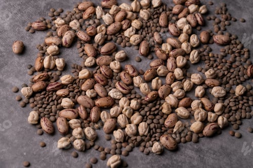 Preview: Closeup shot of coffee beans on a gray board