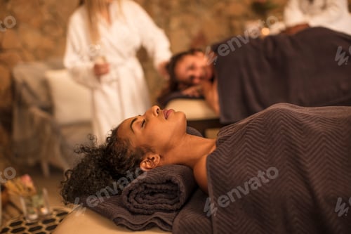 Preview: Woman relaxing on lounge in a spa