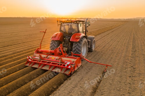 Preview: Tractor harrows in field dragging plow on purified soil