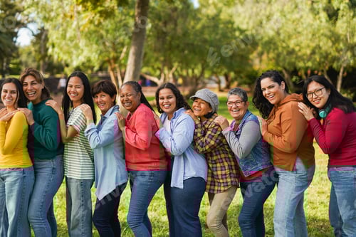 Preview: Multiracial women standing in a line and smiling on camera