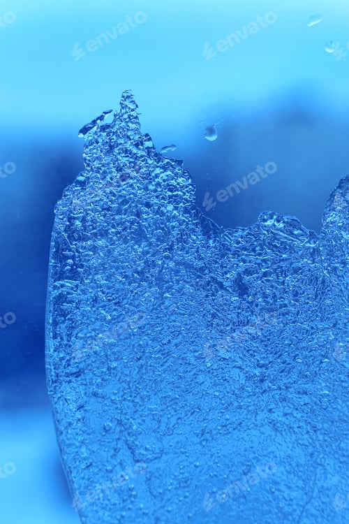 Preview: Blue background with ice on glass, natural texture