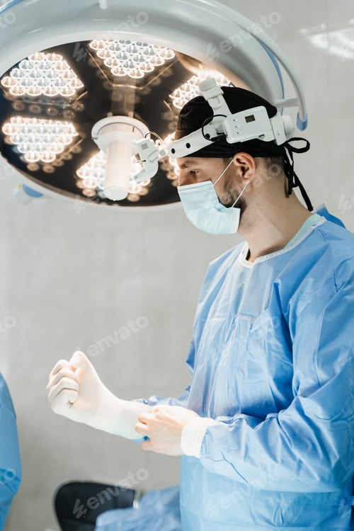 Preview: Surgeon disinfects and prepares with headlight for surgery in medical clinic