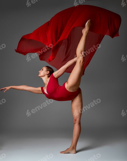 Preview: Ballerina Jumping in Pointe Shoes with Flying Red Cloth, Modern Ballet Dance, Isolated Gray