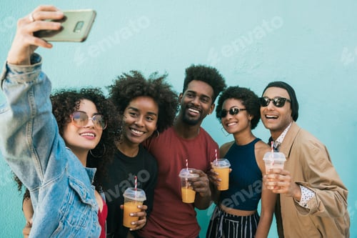 Preview: Multi-ethnic group of friends taking a selfie.