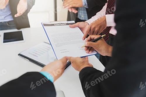 Preview: Businessman offering contract paper to his business partner for sign contract.
