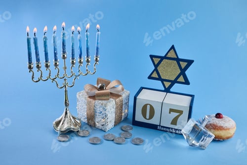 Preview: Jewish holiday Hanukkah with menorah, traditional Candelabra, donut and dreidel, spinning top.