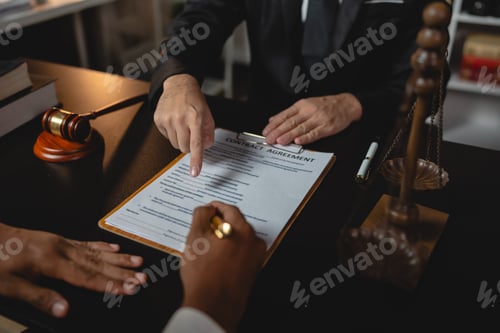 Preview: Lawyer giving advice on judgment, agreement, contract document. Consultation of young businessman an