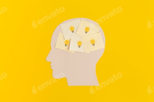Preview: Human head with sticky notes on yellow background