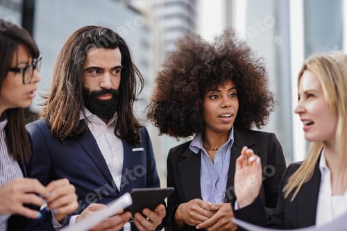 Preview: Group of multiracial business people working outside of office building