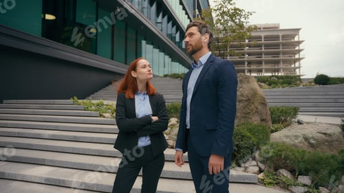 Preview: Caucasian middle-aged businesswoman and adult woman business coworkers partners businessman formal