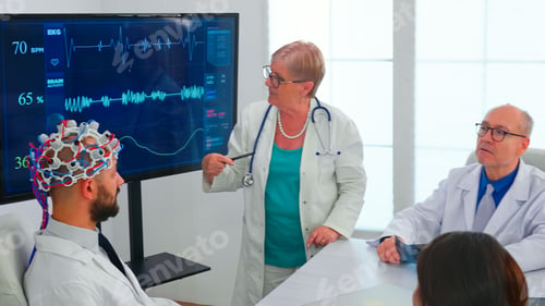 Medical Professionals Discussing Brain Activity in Hospital
