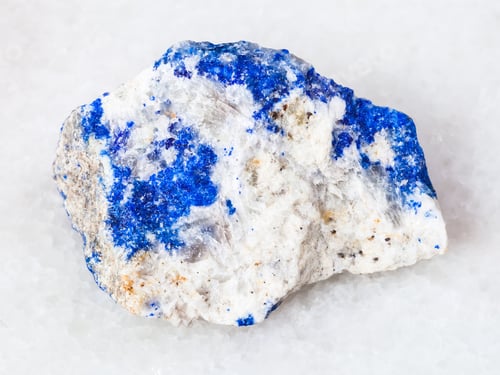 Preview: rough Lazurite (Lapis Lazuli) gemstone on white
