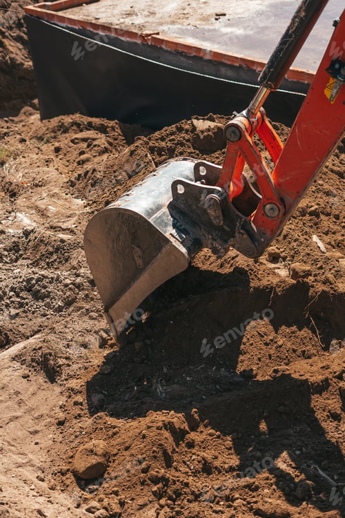Preview: Excavator shovel digging on dirt