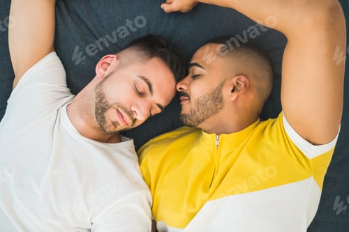 Preview: Gay couple laying down on the floor.