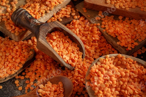 Preview: Red lentils with a wooden spoon
