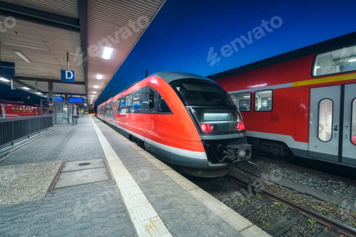 Vista previa: High speed train on the railway station at night