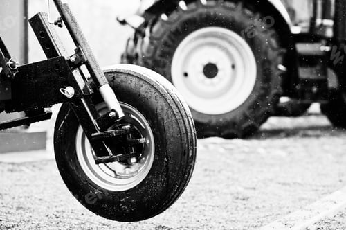 Preview: Wheel of new red agricultural seeder close up view