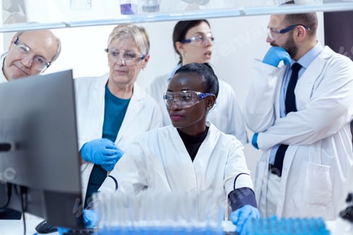 Team of scientists with multiethnicity discussing chemical formula