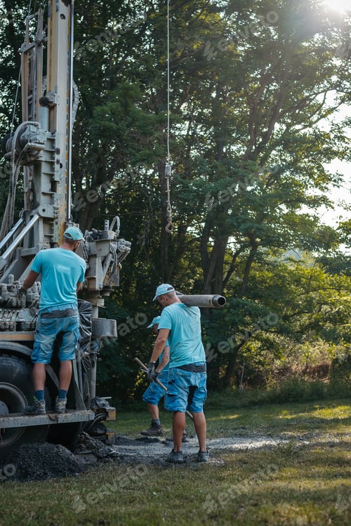 Preview: Water well drilling rig preparing to boring dowin into the earth.