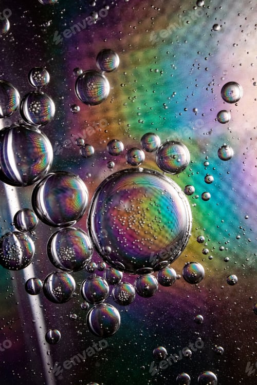 Preview: Vertical shot of soap bubbles on a colorful background with interesting textures