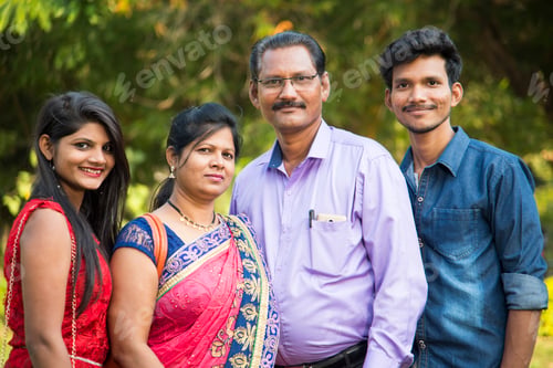 Preview: Happy Indian family at outdoors, Enjoying holiday in park.