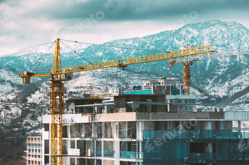 Preview: Construction Crane Is Involved In Development Of A New Multi-storey Residential Building. New