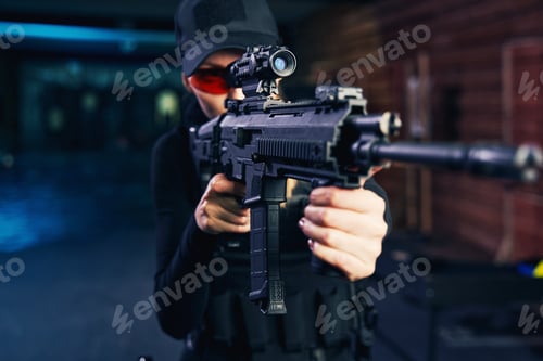 Preview: Concentrated young Caucasian sniper firing a weapon