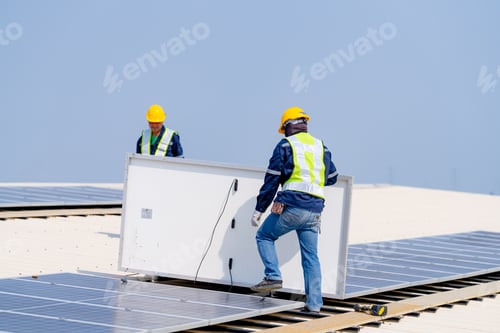 Preview: workers installing solar panels, for efficient energy on rooftop