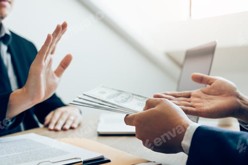 Preview: Businessperson refusing bribe given money by partner with anti bribery corruption concept.