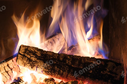Preview: A fireplace with burning logs. Fire in the fireplace. A cozy place to rest.