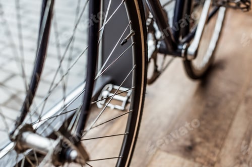 Preview: cropped image of bicycle on wooden floor in house