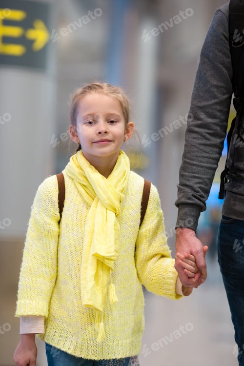 Preview: Adorable little girl in airport waiting for boarding