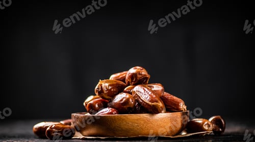 Preview: Full wooden plate with dates on the table.