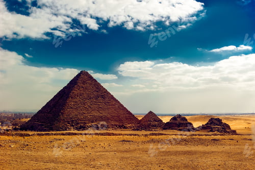Preview: Scenic shot of the Pyramids of Giza in Egypt under the cloudy sky surrounded by the sand