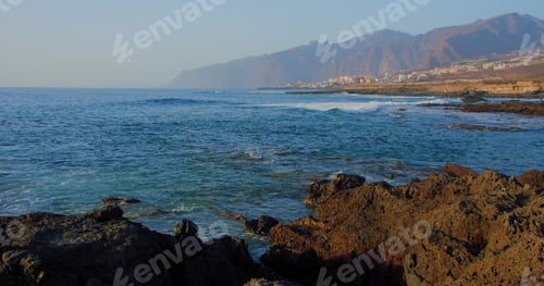 Preview: Coastline of Atlantic Ocean with cityscape, Los Gigantes cliffs in Puerto de Santiago