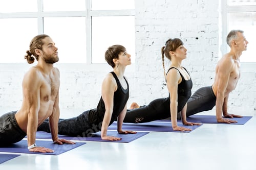 Preview: People practising yoga in the studio