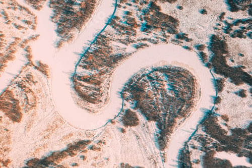 Preview: Aerial view forest woods and river landscape in winter day. Top view of beautiful european nature