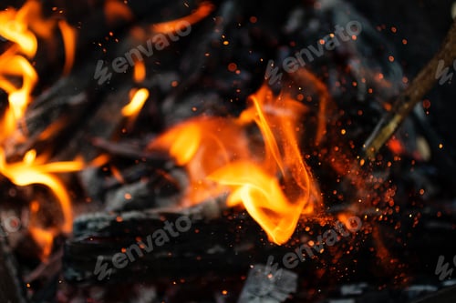 Preview: Closeup photography of the burning flame and sparkles.