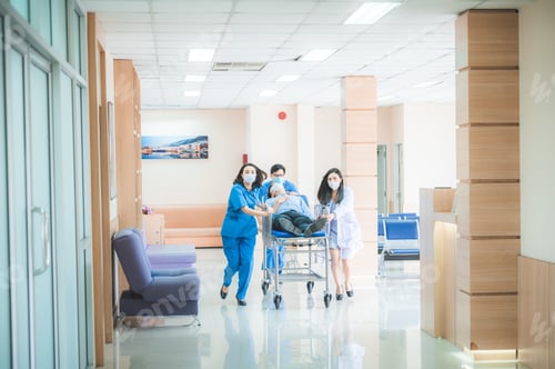 Preview: Hospital emergency team medical staff patient stretcher urgent care modern clinic hallway with