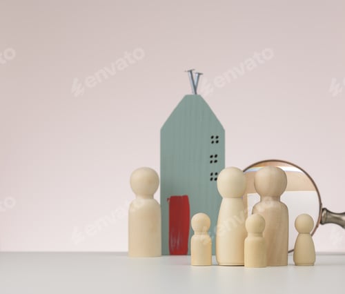 Preview: Magnifier and wooden house on a brown background. Real estate rental, purchase and sale concept