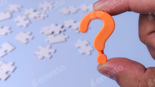 Preview: Question Mark Icon and Puzzle Pieces Representing Problem Solving and Finding Solutions to a Mystery