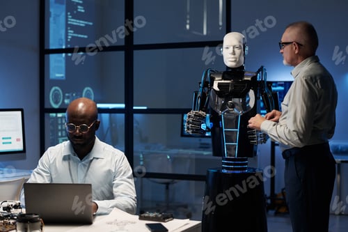 Preview: Engineers programming robot in the lab