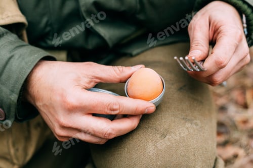 Preview: Soldier Of USA Infantry Of World War II Holds Egg Holder In Hands During Breakfast