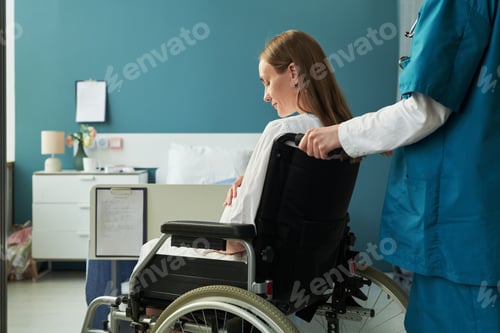 Preview: Caucasian Young Adult Woman with Disability Being Assisted by Medical Worker