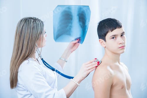 Preview: Doctor Examining An X-Ray Light