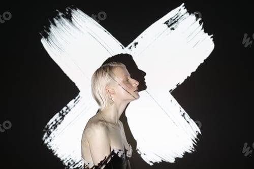Preview: beauty portrait of androgynous woman with abstract projection screen on her face