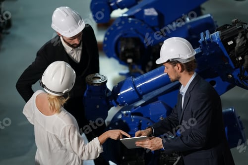 Preview: Robotics engineer working on maintenance of robotic arm in factory warehouse. Business technology.